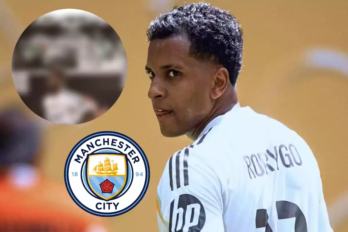 Soccer player wearing a white jersey with the name Rodrygo, the Manchester City crest, and a blurry circle in the top left corner