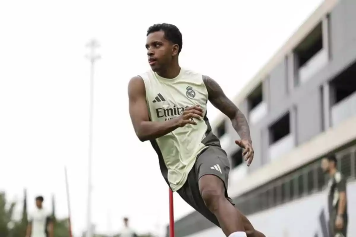 Soccer player training in a Real Madrid uniform on an outdoor field Soccer player training in a Real Madrid uniform on an outdoor field