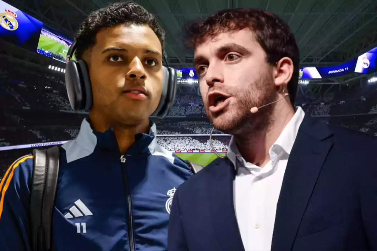 Two people in a soccer stadium, one wearing headphones and a Real Madrid sports jacket, and the other with a headset microphone and a blue blazer.