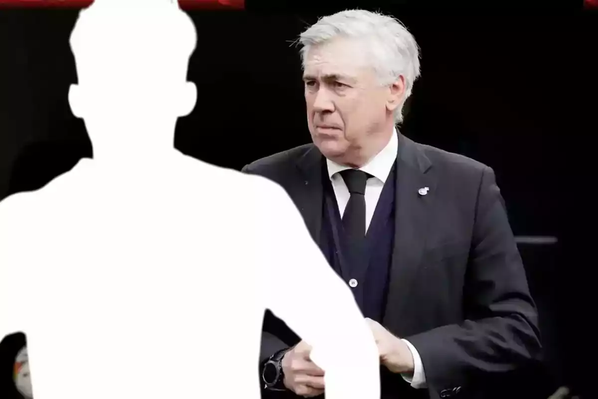 Gray-haired man in a dark suit looking to the left while a white silhouette covers part of the image
