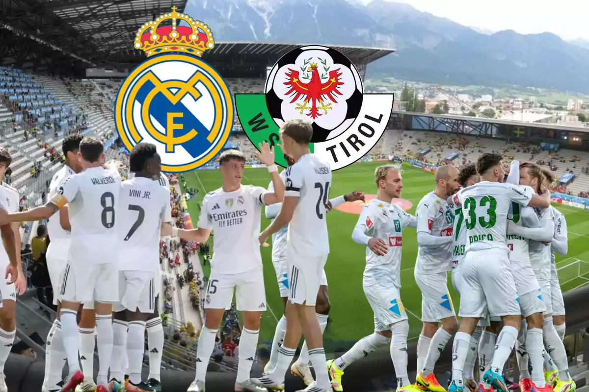 Real Madrid and WSG Tirol players celebrating in a stadium with both teams’ crests in the background and mountains visible behind.