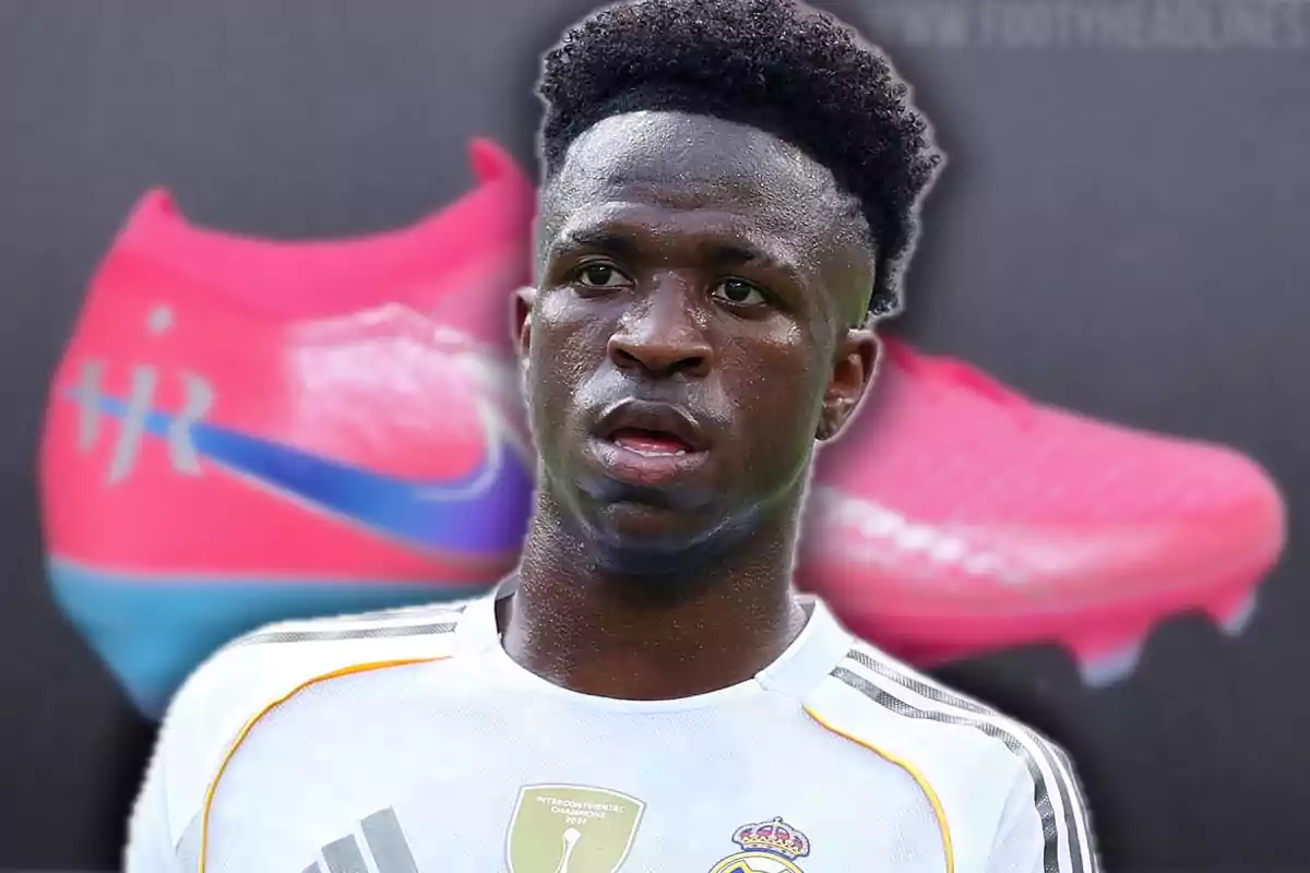 Soccer player wearing a white jersey with the Real Madrid crest on the front, against a background of pink and blue sports shoes.