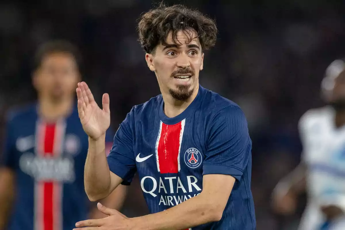 PSG player gesturing during a match with a focused expression PSG player gesturing during a match with a focused expression