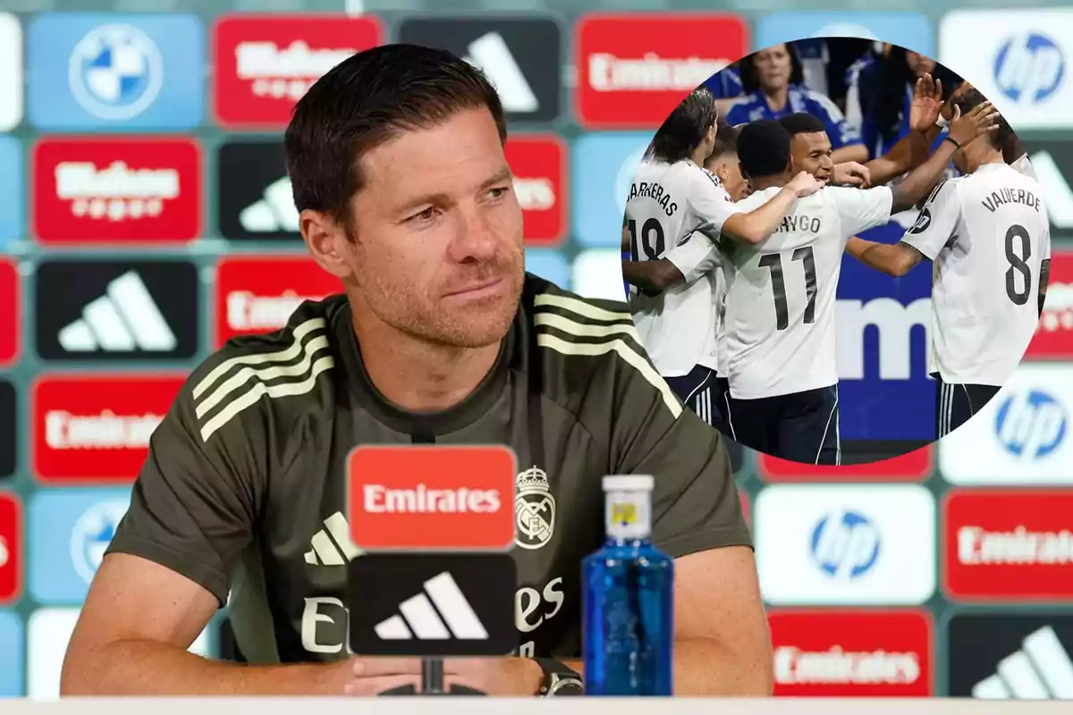 Real Madrid coach at a press conference with a sponsor backdrop and a circle showing team players celebrating a goal