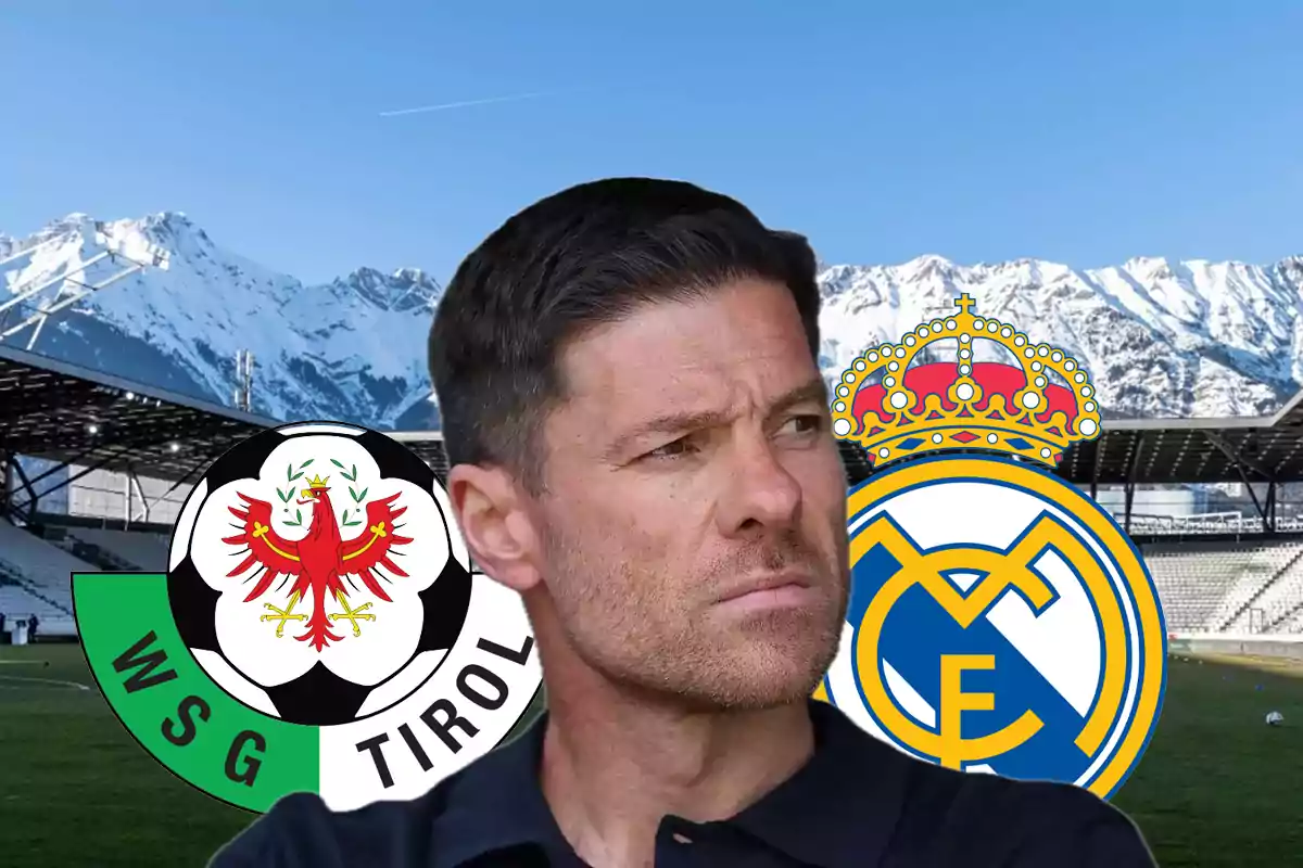 A man with short hair and a trimmed beard appears in the foreground with a serious expression; in the background, a soccer stadium surrounded by snow-capped mountains can be seen, with the WSG Tirol and Real Madrid crests on either side.