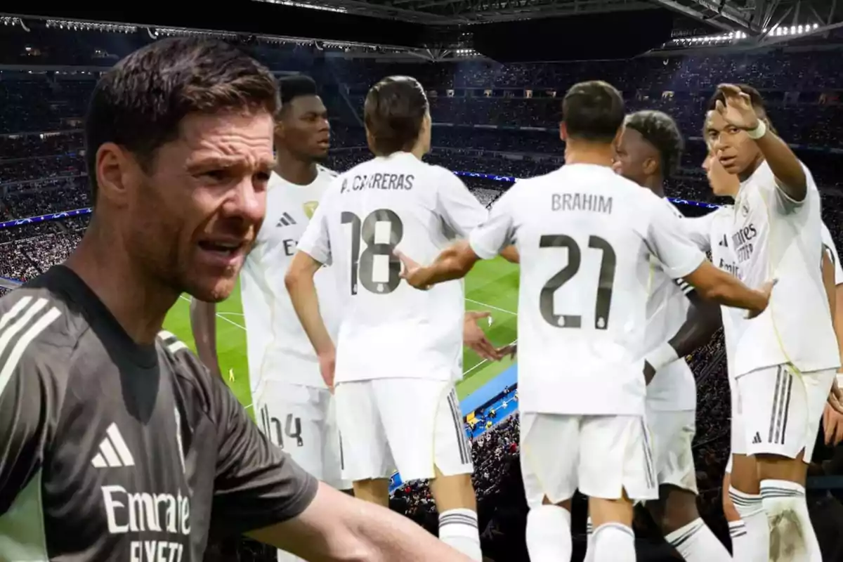 Coach and players of a soccer team dressed in white celebrating in a stadium full of fans