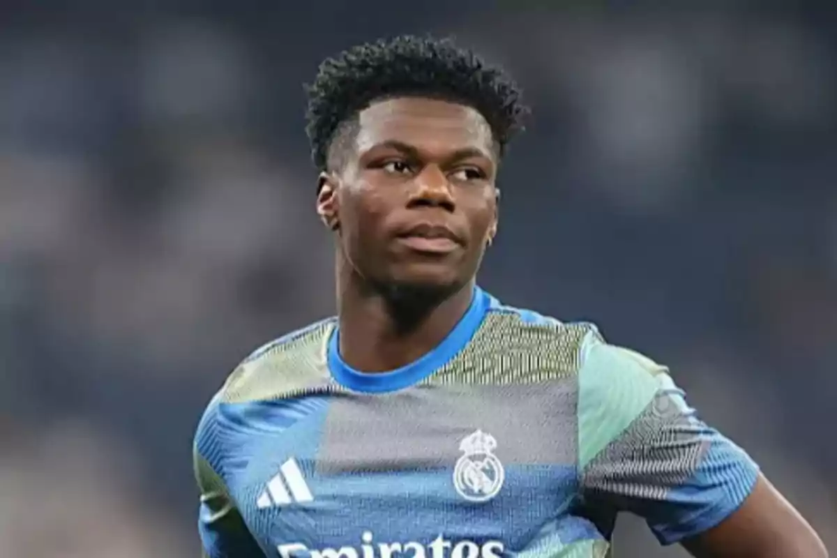 Soccer player wearing a Real Madrid training jersey during a match