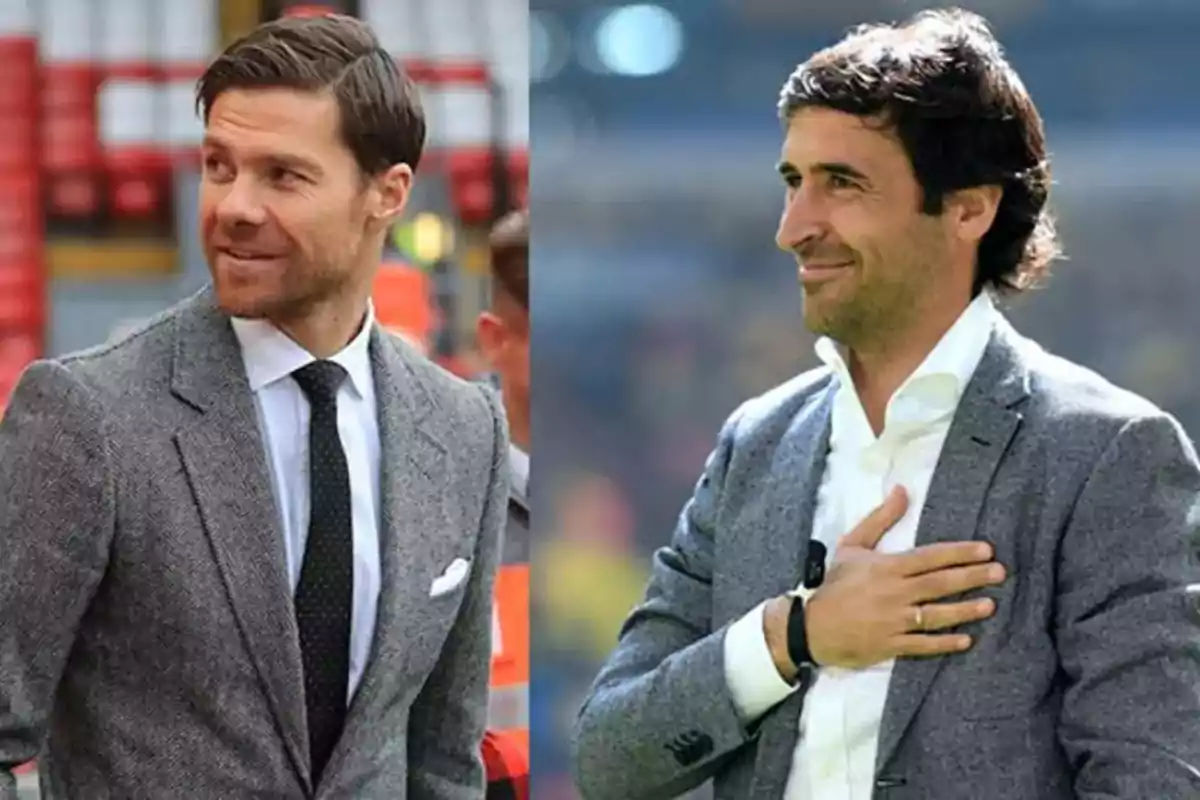 Two men dressed in gray jackets and white jerseys, one of them wearing a black tie and the other with his hand on his chest, both are outdoors and smiling.