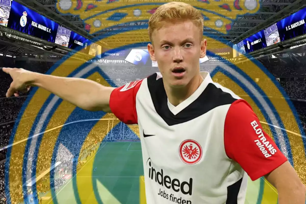 Eintracht Frankfurt player pointing with an outstretched arm against a stadium background with the Real Madrid crest blurred.