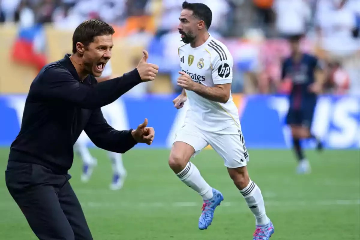 Coach giving energetic instructions while a player in a white uniform runs on the field during a match
