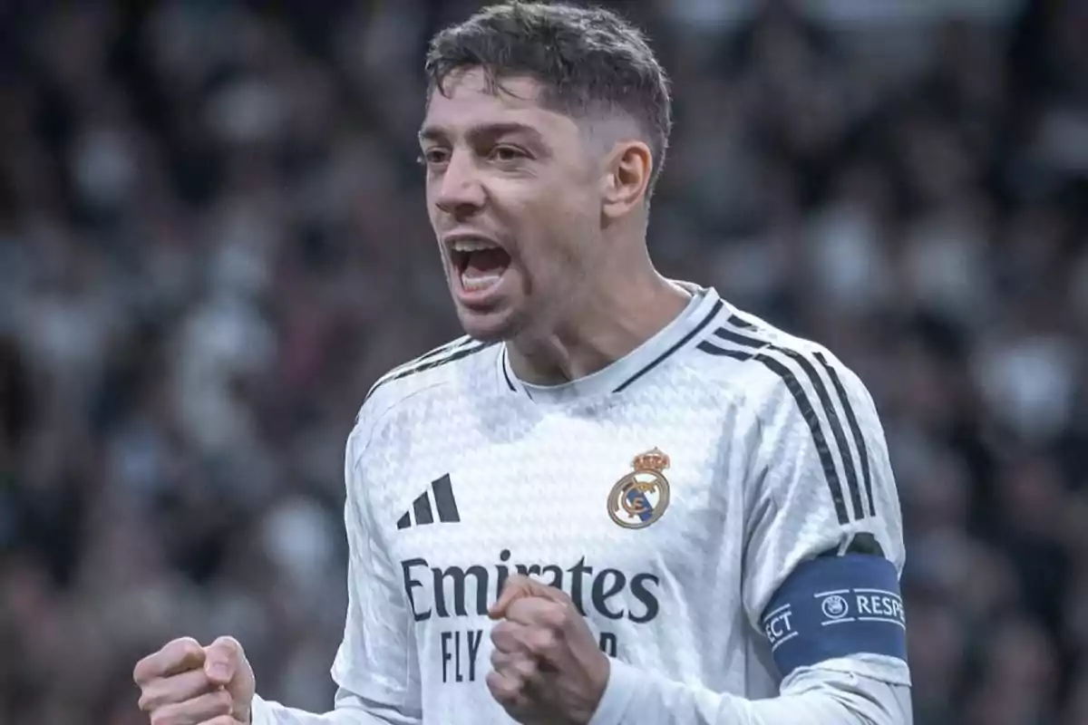 Real Madrid player celebrating with excitement during a match, wearing the white uniform and the captain's armband Real Madrid player celebrating with excitement during a match, wearing the white uniform and the captain's armband