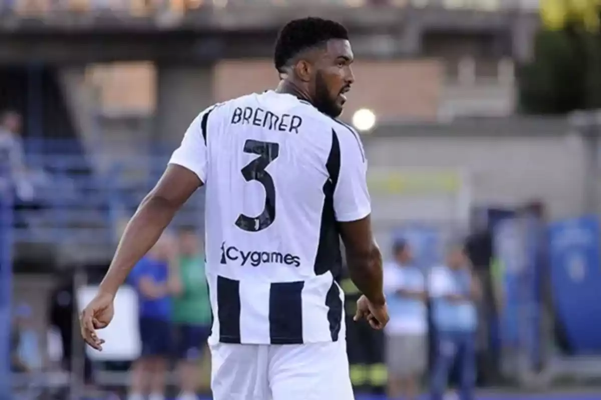 Soccer player wearing Juventus’ black and white uniform showing the number 3 on the back during a match Soccer player wearing Juventus’ black and white uniform showing the number 3 on the back during a match