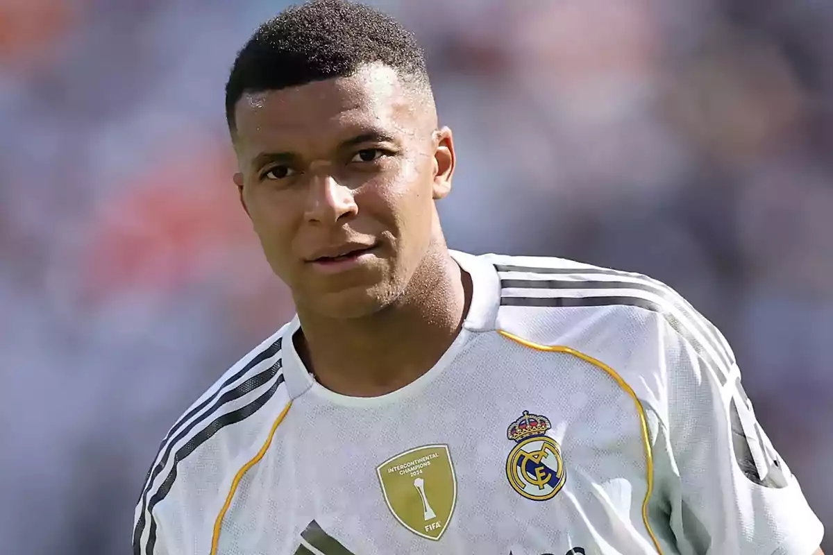 Soccer player wearing a white Real Madrid jersey during a match Soccer player wearing a white Real Madrid jersey during a match