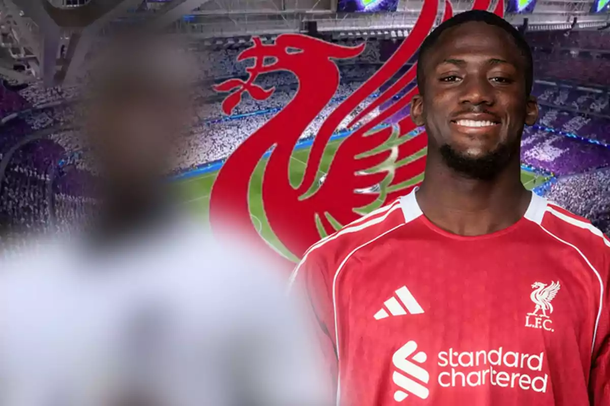 Smiling Liverpool footballer with the club logo and a stadium in the background