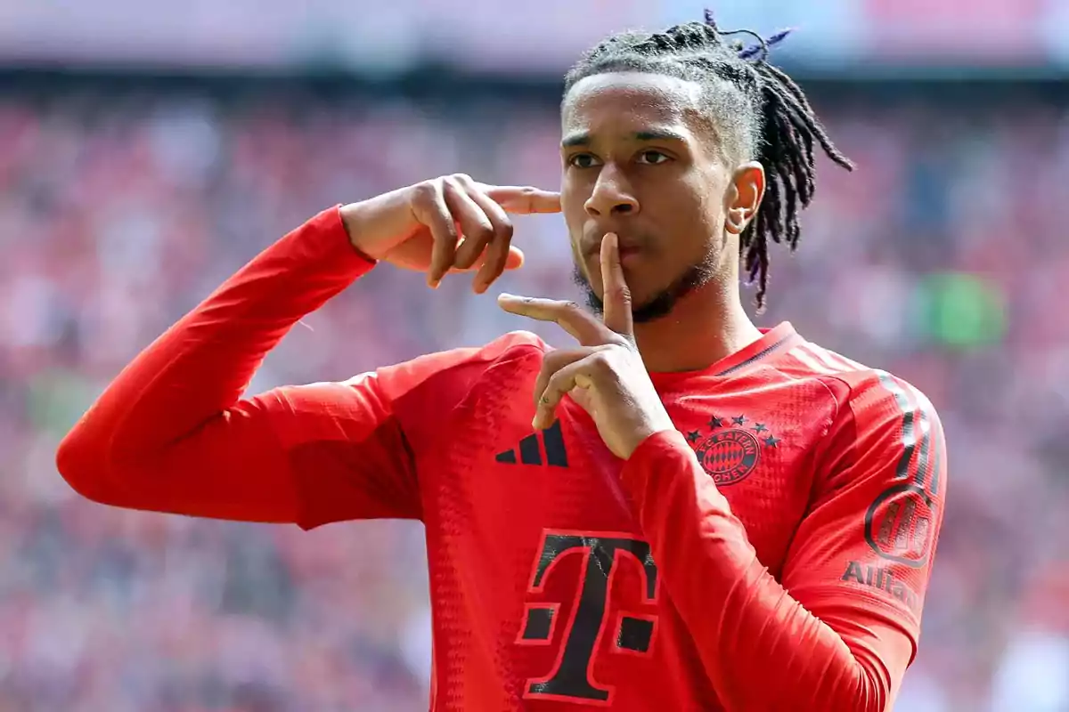 Bayern Munich player celebrating a goal with a silence gesture in the stadium Bayern Munich player celebrating a goal with a silence gesture in the stadium