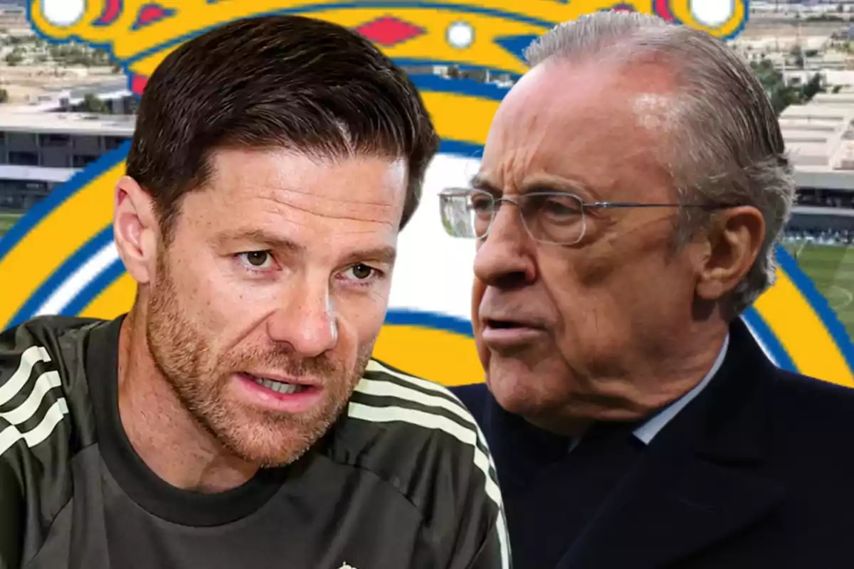 Two men talking with the Real Madrid crest in the background