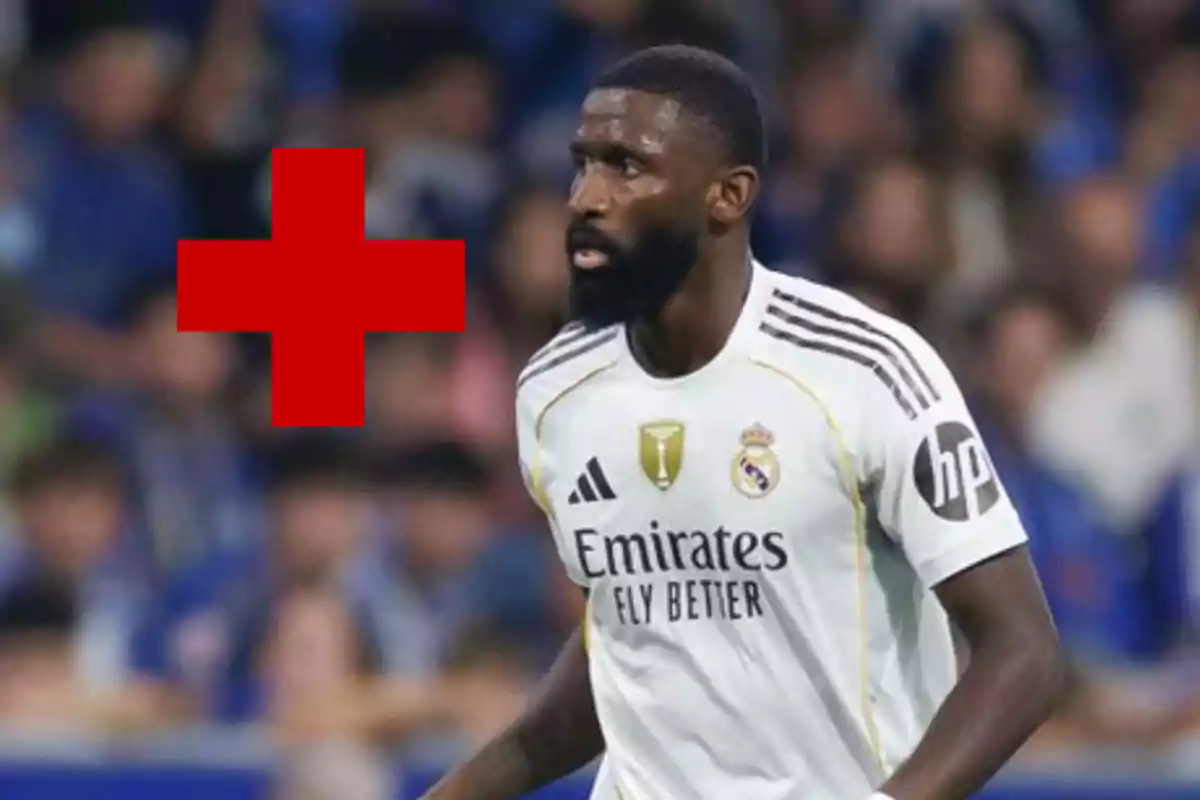 Real Madrid player on the field with a red cross in the background indicating a possible injury