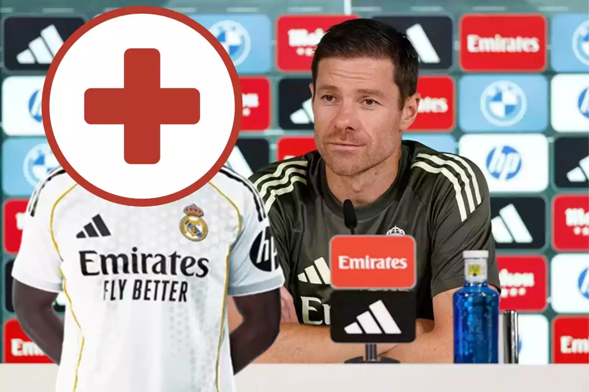 Football coach at a press conference alongside a Real Madrid player whose face is covered by a red cross symbol
