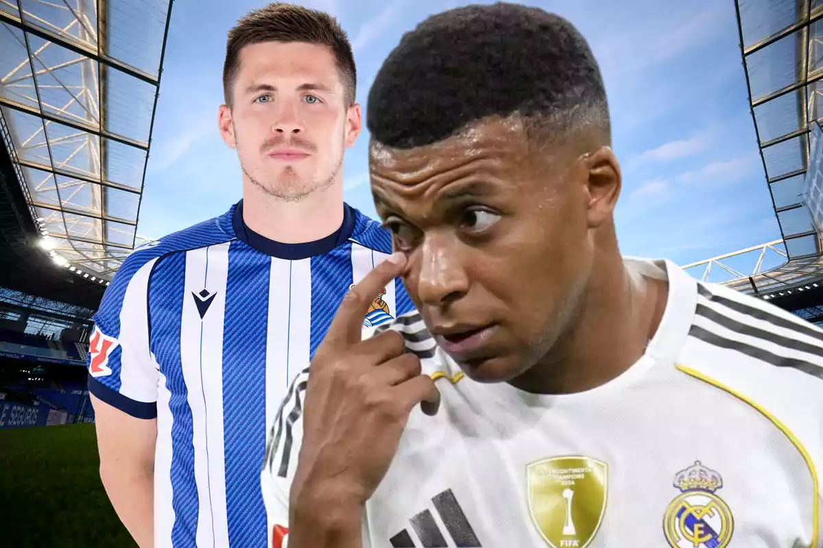 Two players wearing Real Sociedad and Real Madrid uniforms pose in a soccer stadium.