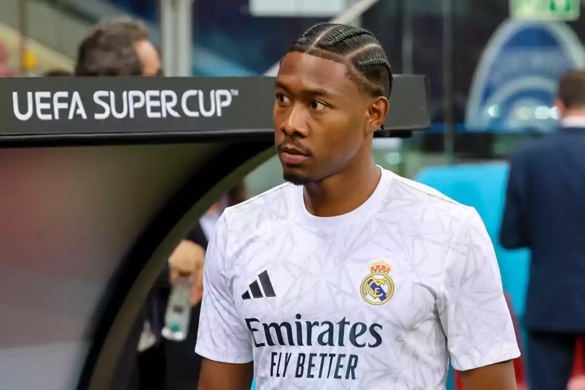 A soccer player wearing a Real Madrid jersey in a stadium during the UEFA Super Cup. A soccer player wearing a Real Madrid jersey in a stadium during the UEFA Super Cup.