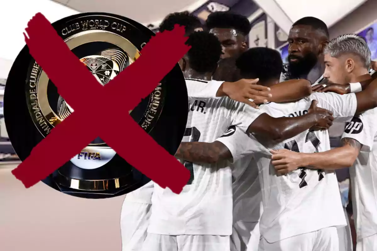 Soccer players celebrating in a group with a trophy crossed out in the foreground.