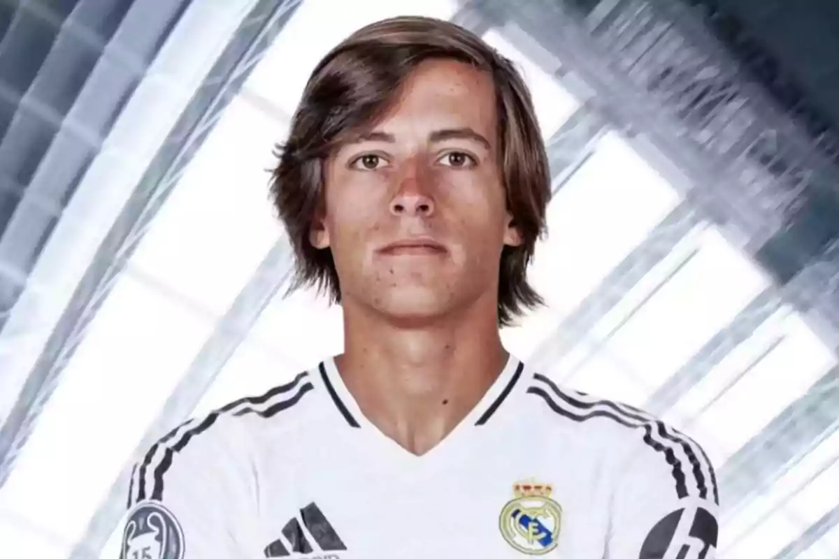 Soccer player in a white Real Madrid uniform posing in front of an abstract background. Soccer player in a white Real Madrid uniform posing in front of an abstract background.
