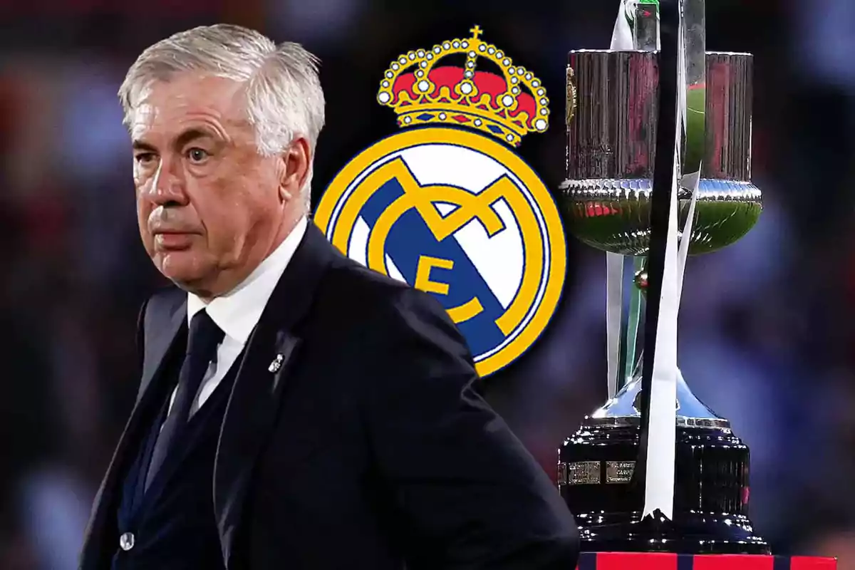 A man in a suit next to the Real Madrid crest and a trophy.