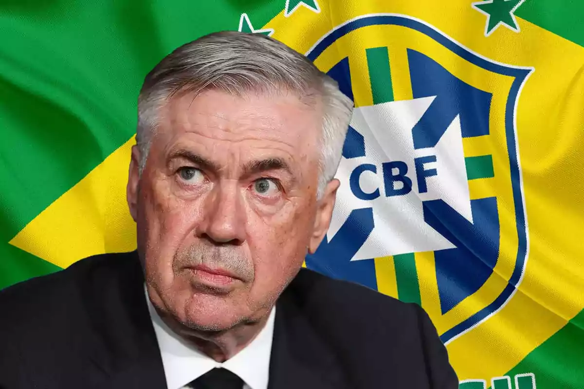 A gray-haired man with a serious expression in front of a Brazilian flag with the CBF emblem.