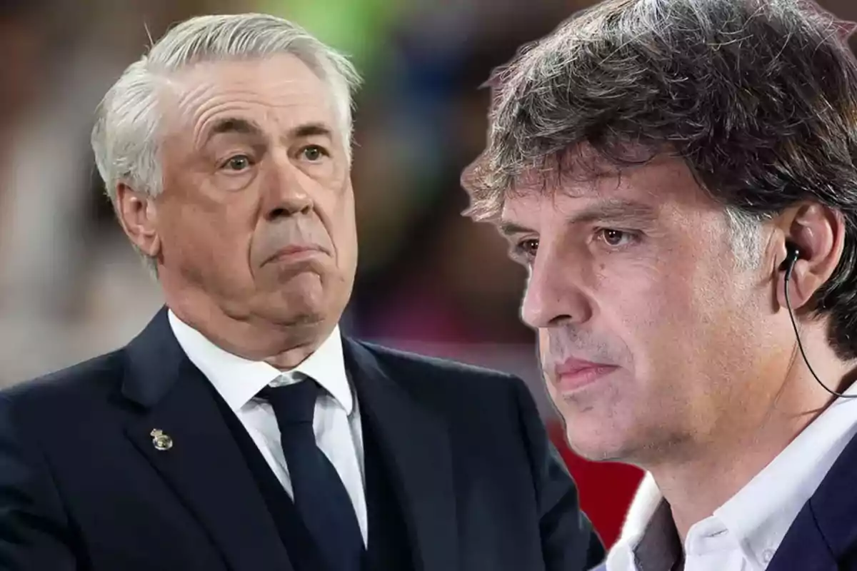 Two men in suits, one with a serious expression and the other with headphones, in a sports setting.
