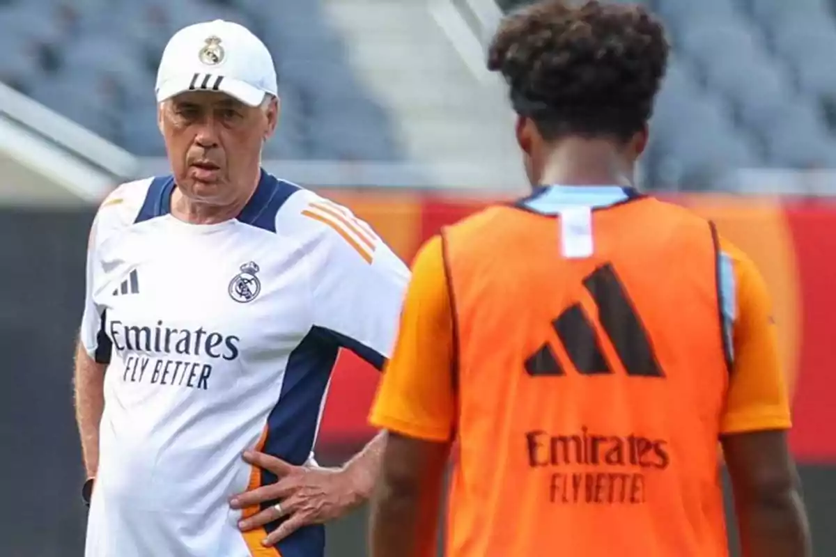 A Real Madrid soccer coach watches a player during training.