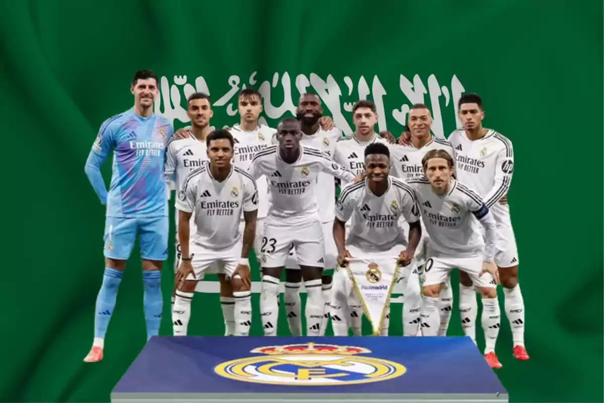 Football players in white uniforms pose in front of a green flag with Arabic writing and a Real Madrid crest in the foreground.