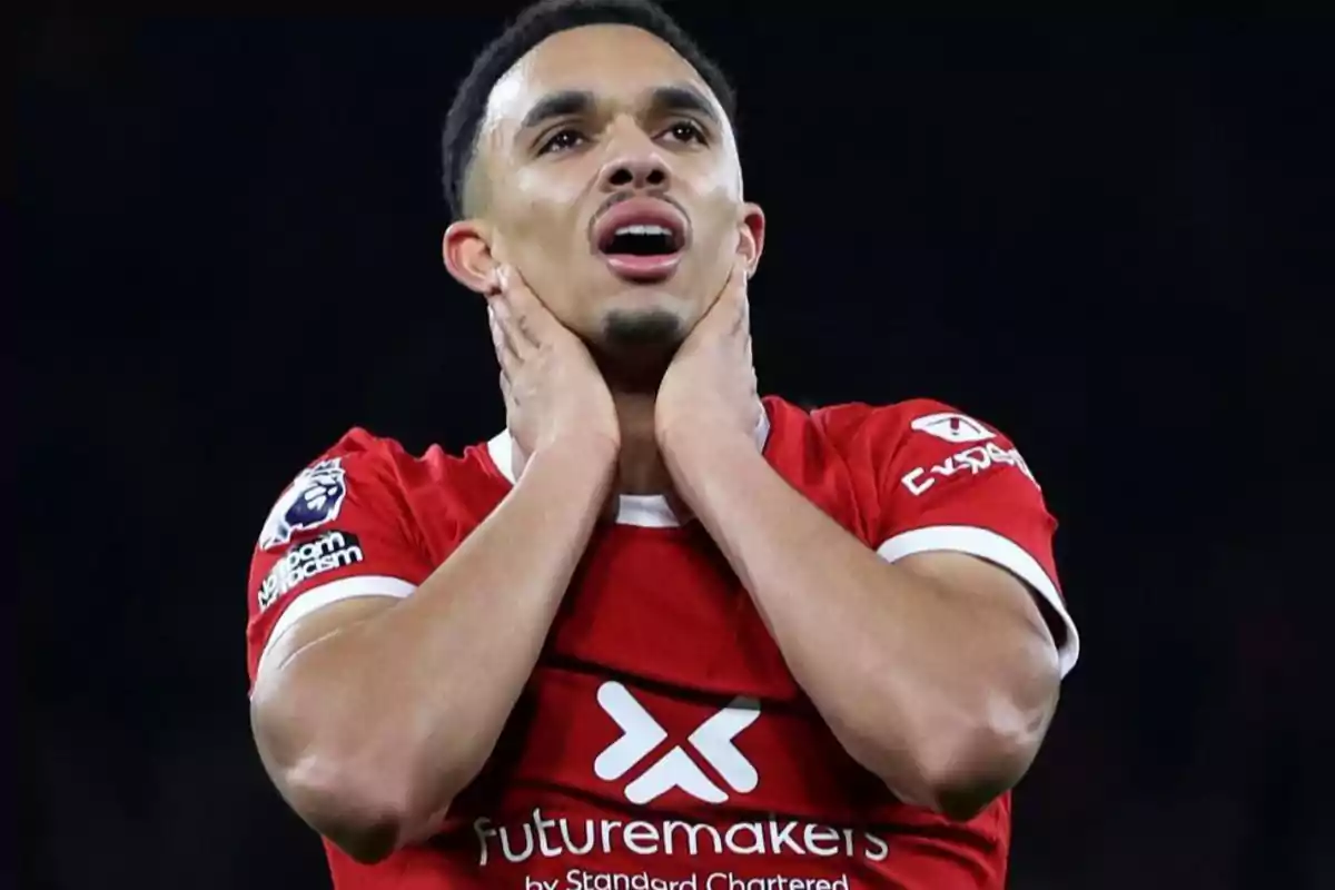Soccer player with frustrated expression and hands on neck during a match. Soccer player with frustrated expression and hands on neck during a match.
