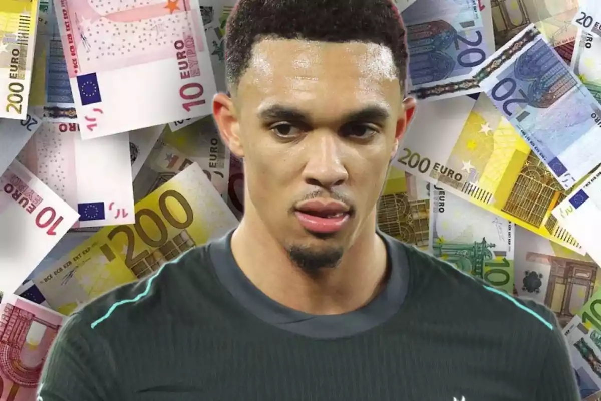 A man in a dark T-jersey appears in front of a background of euro banknotes of different denominations.