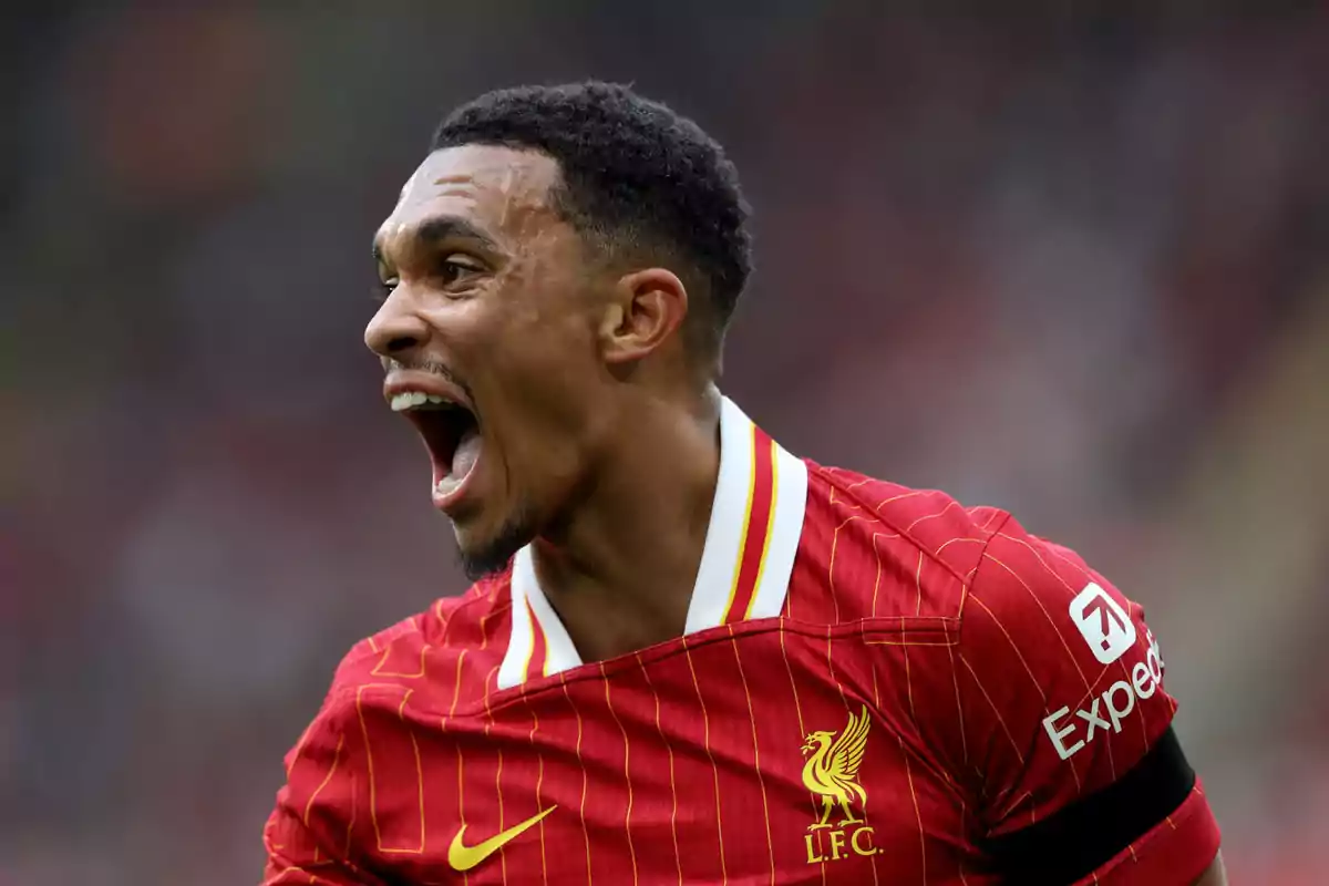 Football player in red jersey celebrating on the field. Football player in red jersey celebrating on the field.
