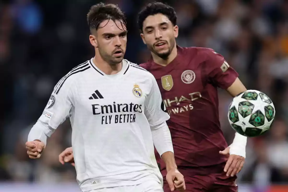 Two players in action during a match, one in a white uniform and the other in a maroon uniform, with a soccer ball nearby.