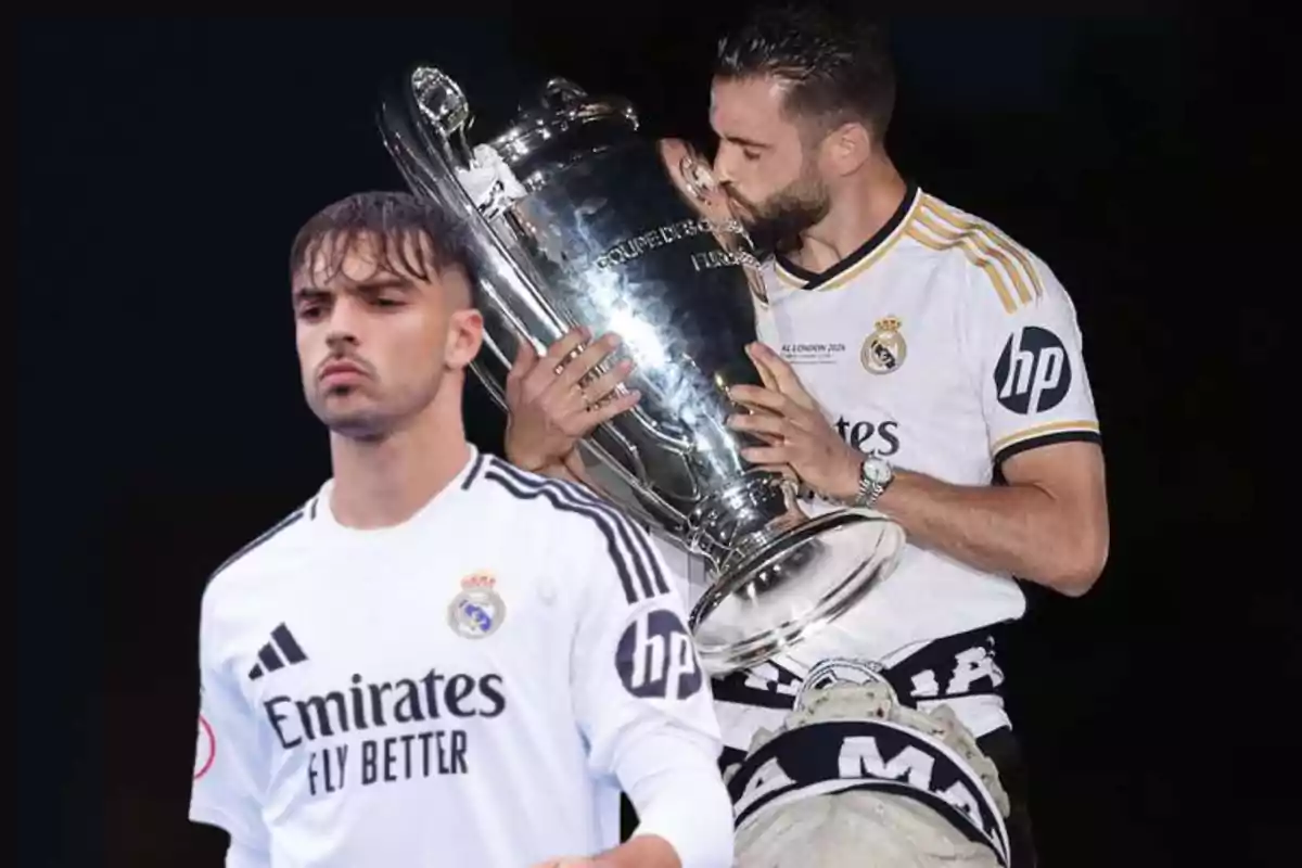 Dos jugadores del Real Madrid, uno besando un trofeo y otro mirando al frente, ambos con el uniforme del equipo.