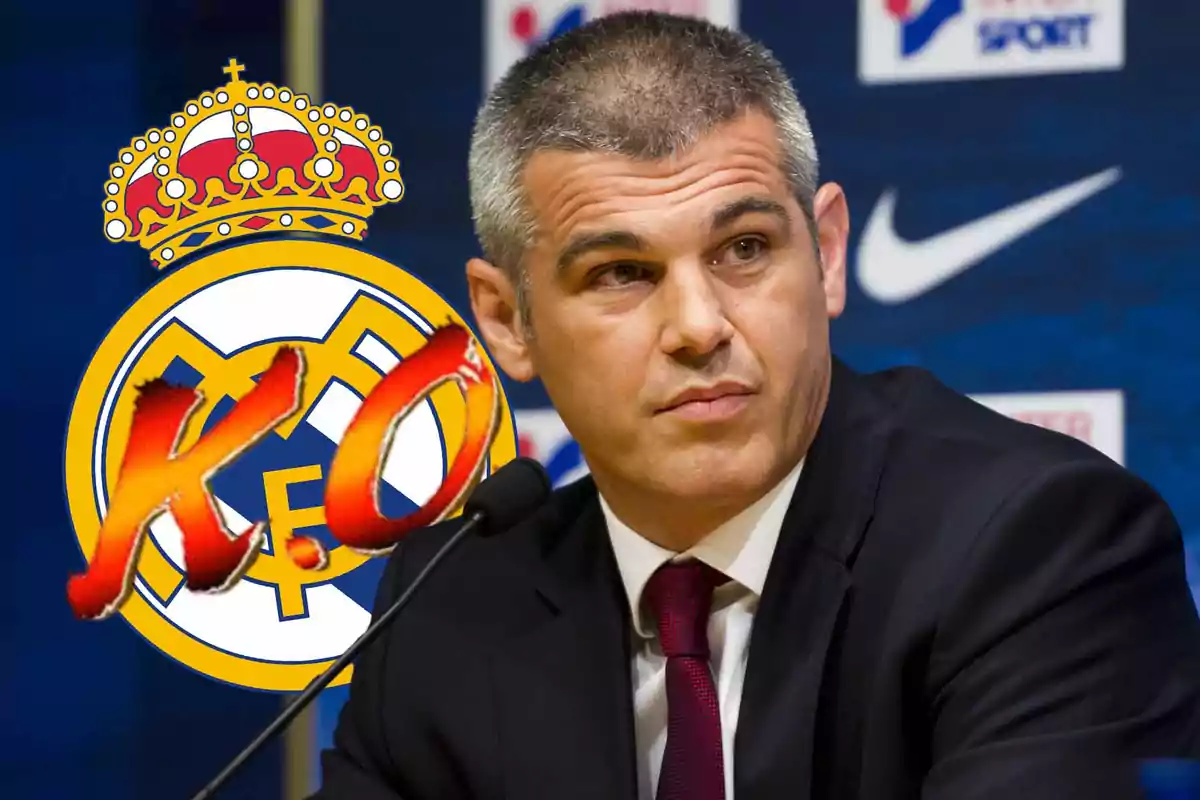 A man in a suit in front of a microphone with a soccer team logo and the letters "K.O." overlaid.