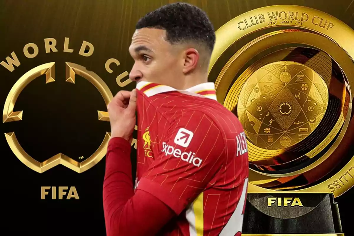 Un jugador de fútbol con una camiseta roja se cubre la boca mientras está de pie frente a un trofeo dorado del Mundial de Clubes de la FIFA.