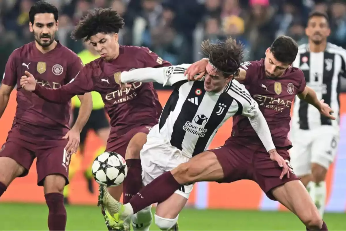 Soccer players from two teams compete for the ball during a match.