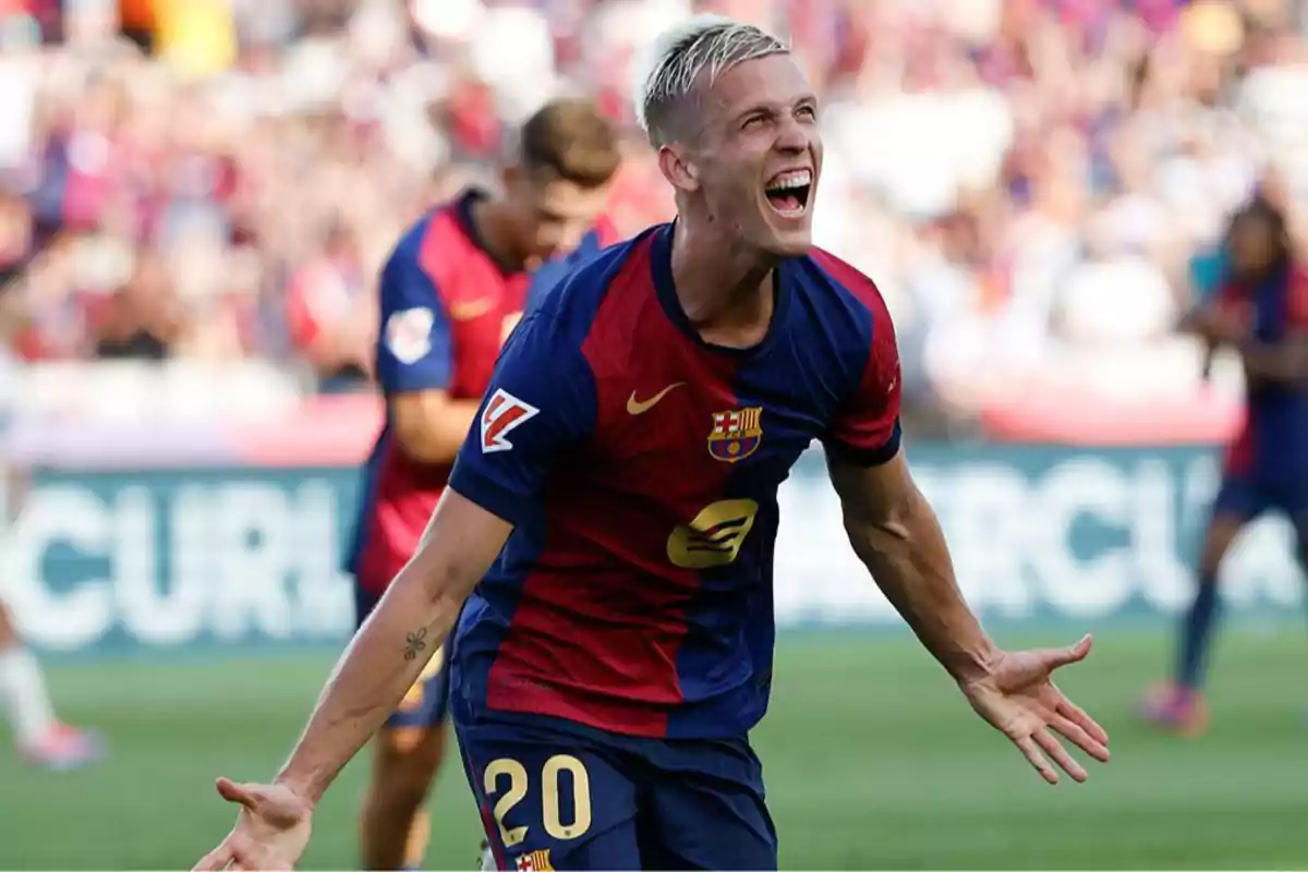 Football player celebrating a goal in a match wearing the FC Barcelona uniform.