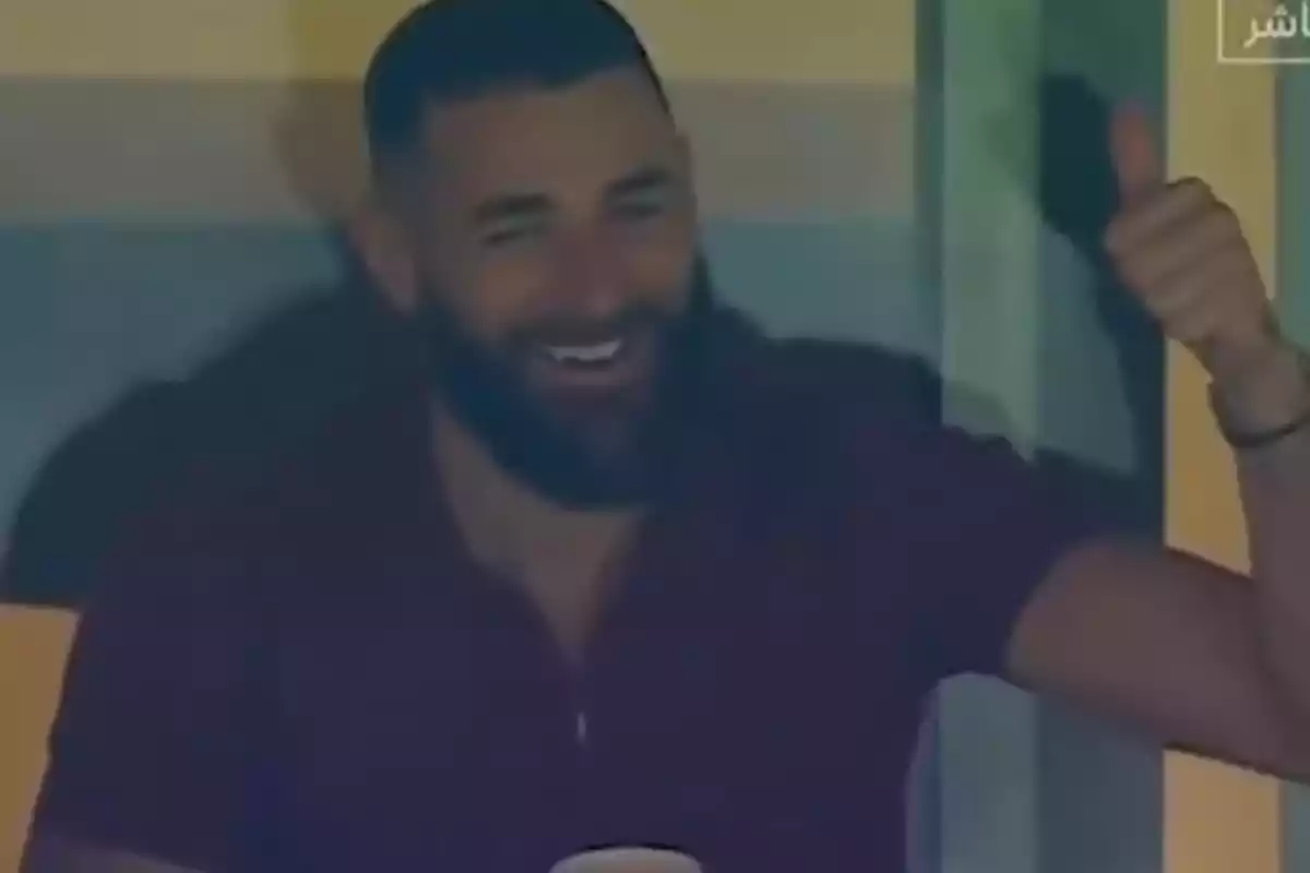 A bearded man smiles as he gives a thumbs up. A bearded man smiles as he gives a thumbs up.