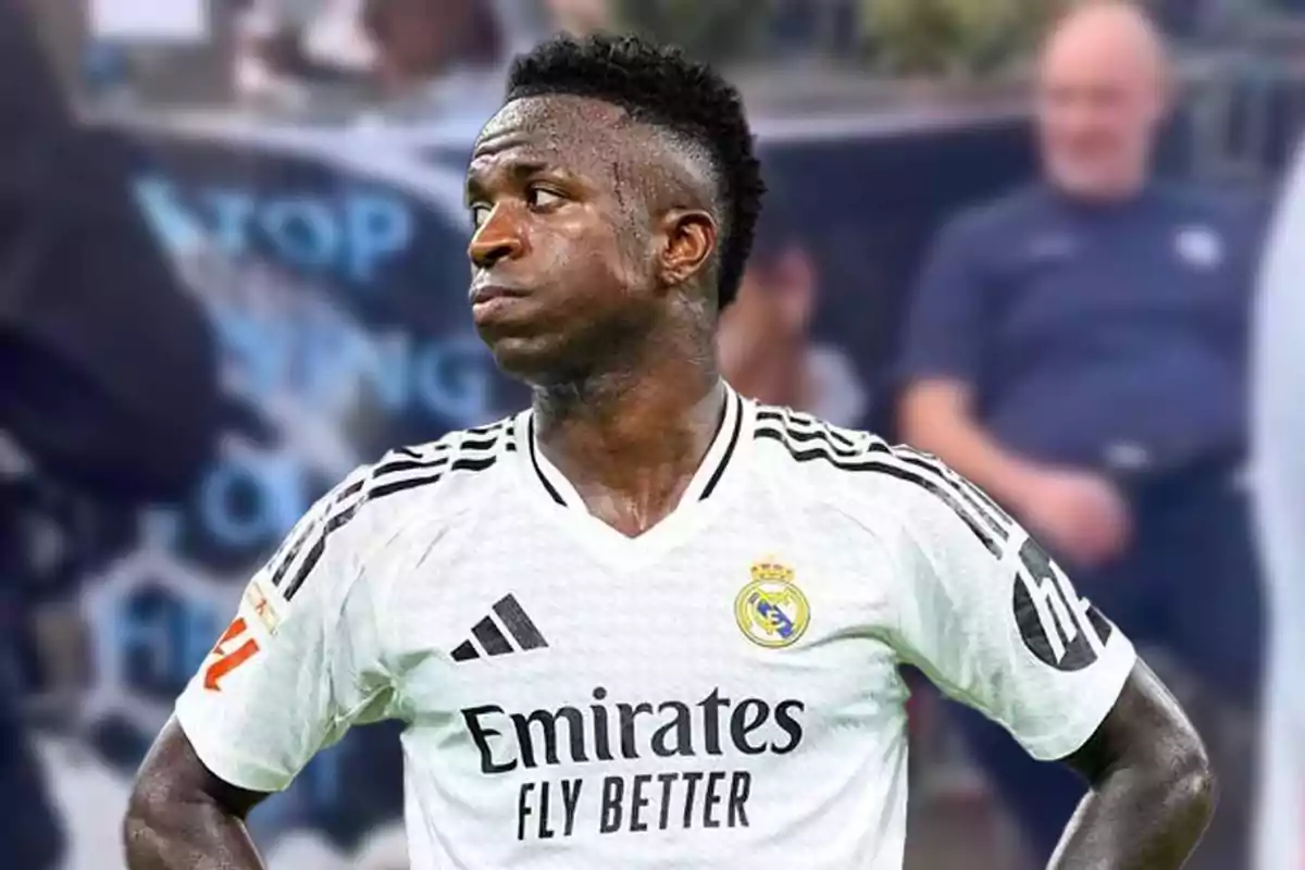 A player in the white Real Madrid uniform on the field.