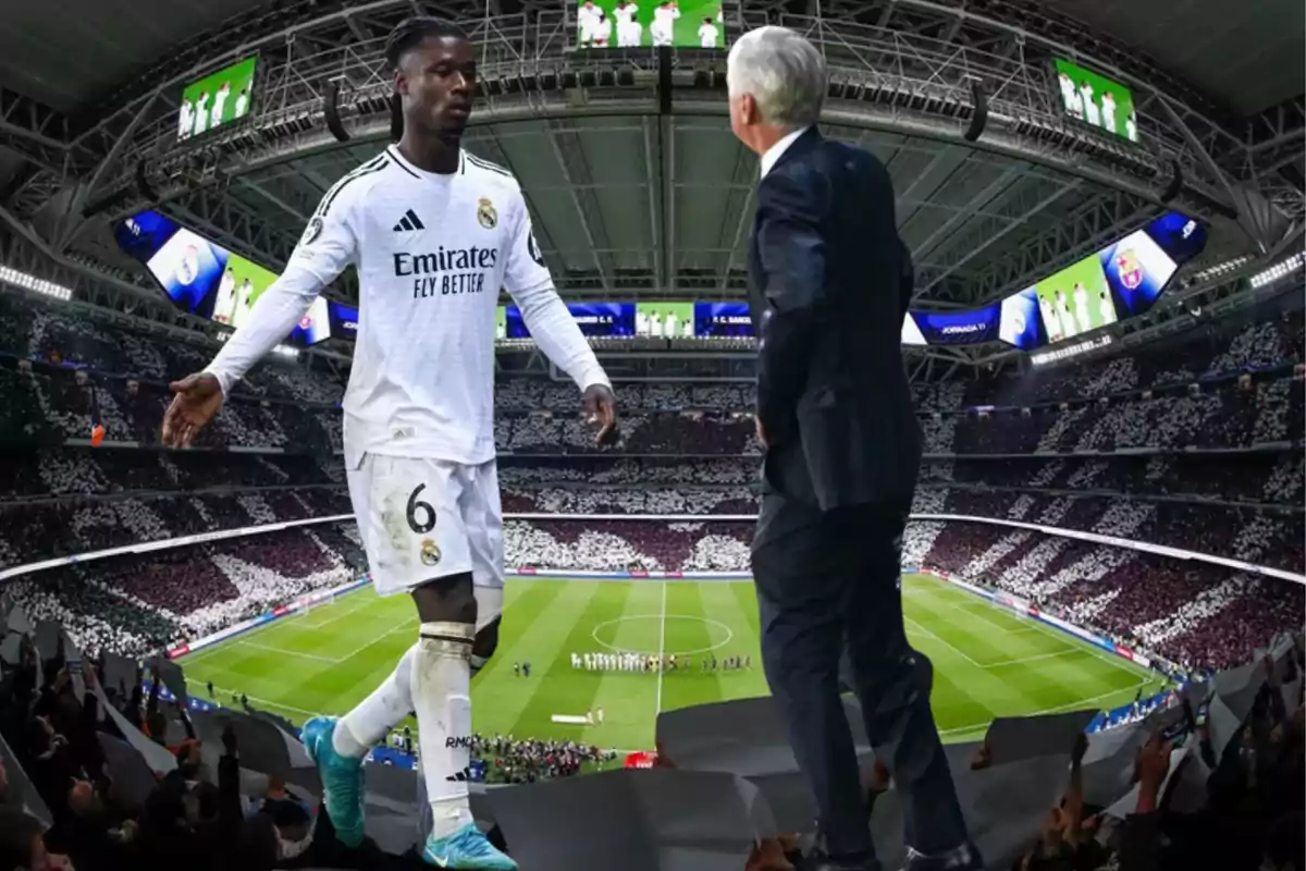 A player from Real Madrid walks toward a man in a suit in a stadium full of spectators.