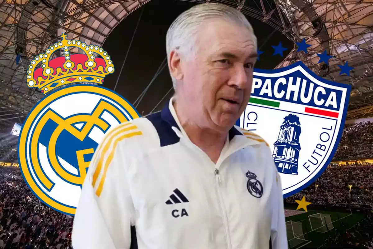 A man in a white sports jacket with Real Madrid and Pachuca logos in a stadium.