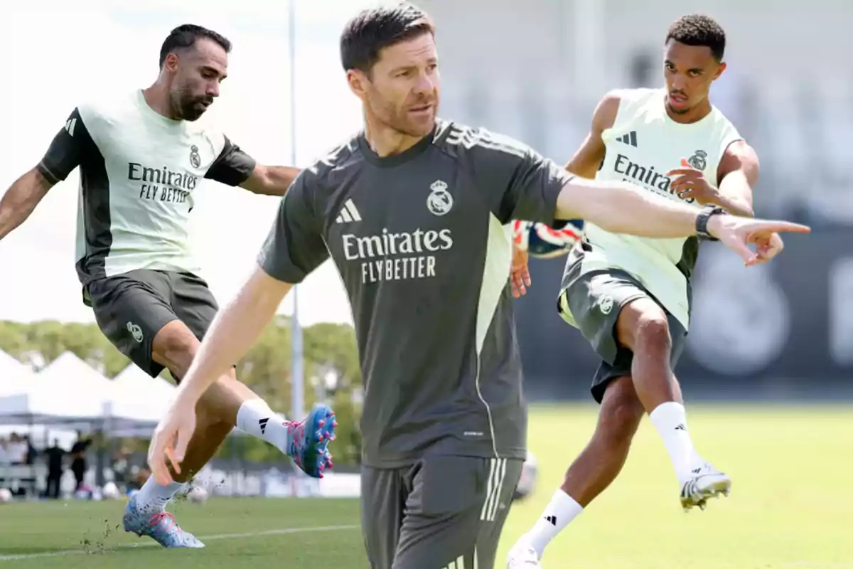 Coach and two Real Madrid players training on a soccer field, all wearing the club’s training kit