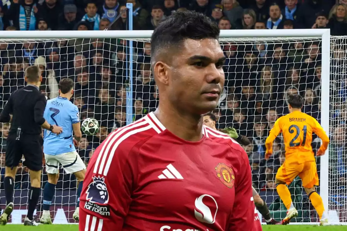 A player in a red uniform is in the foreground, while in the background a match with players and a goalkeeper in front of the goal can be seen.