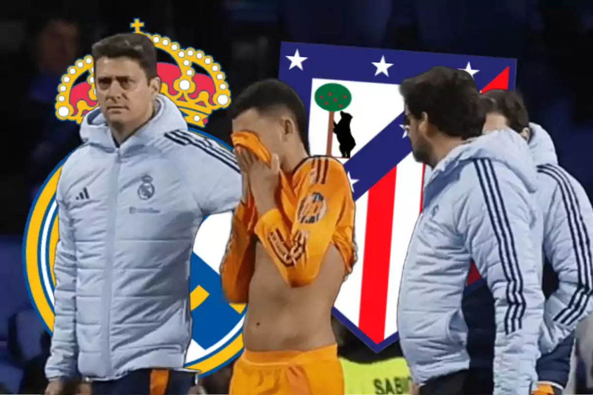 A player in an orange uniform covers his face while surrounded by people in sports jackets, with the crests of Real Madrid and Atlético de Madrid in the background.