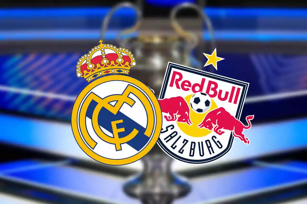 Real Madrid and Red Bull Salzburg soccer team crests on a blurred background of a trophy.