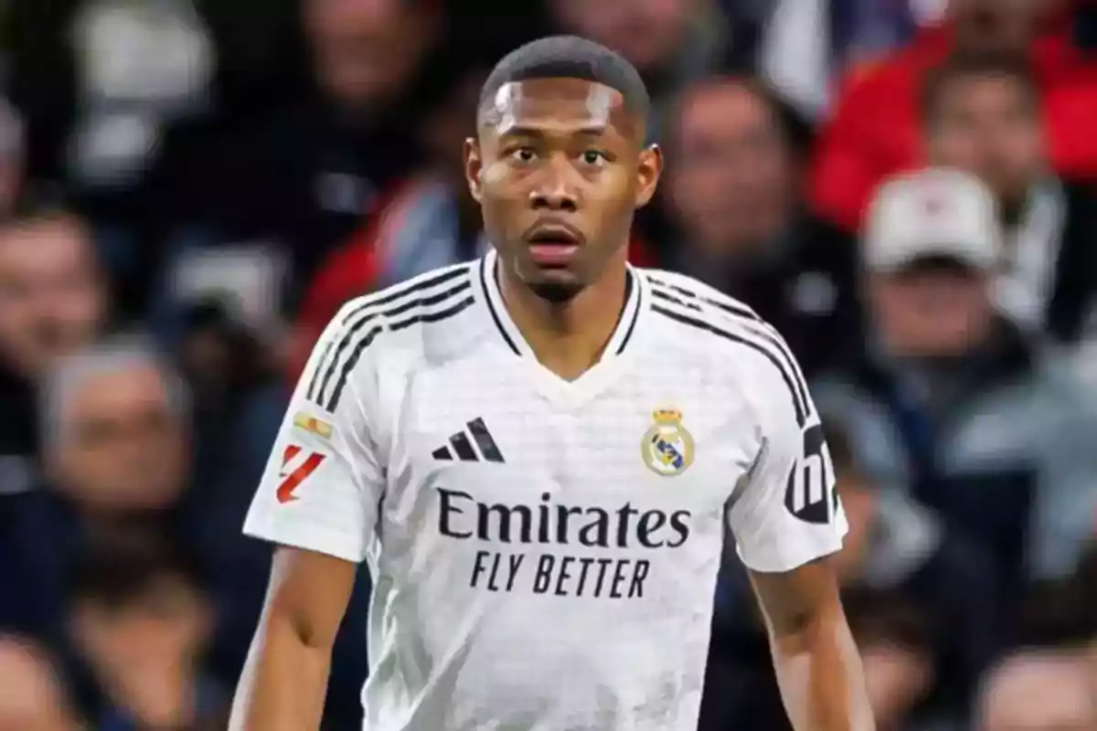 Real Madrid player in a white uniform on the field. Real Madrid player in a white uniform on the field.