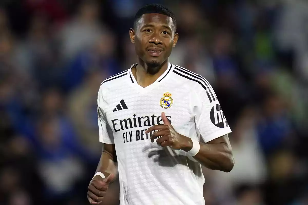A player in the white Real Madrid uniform on the field during a match. A player in the white Real Madrid uniform on the field during a match.